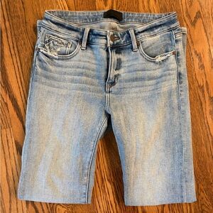 Buckle Black light wash skinny jeans